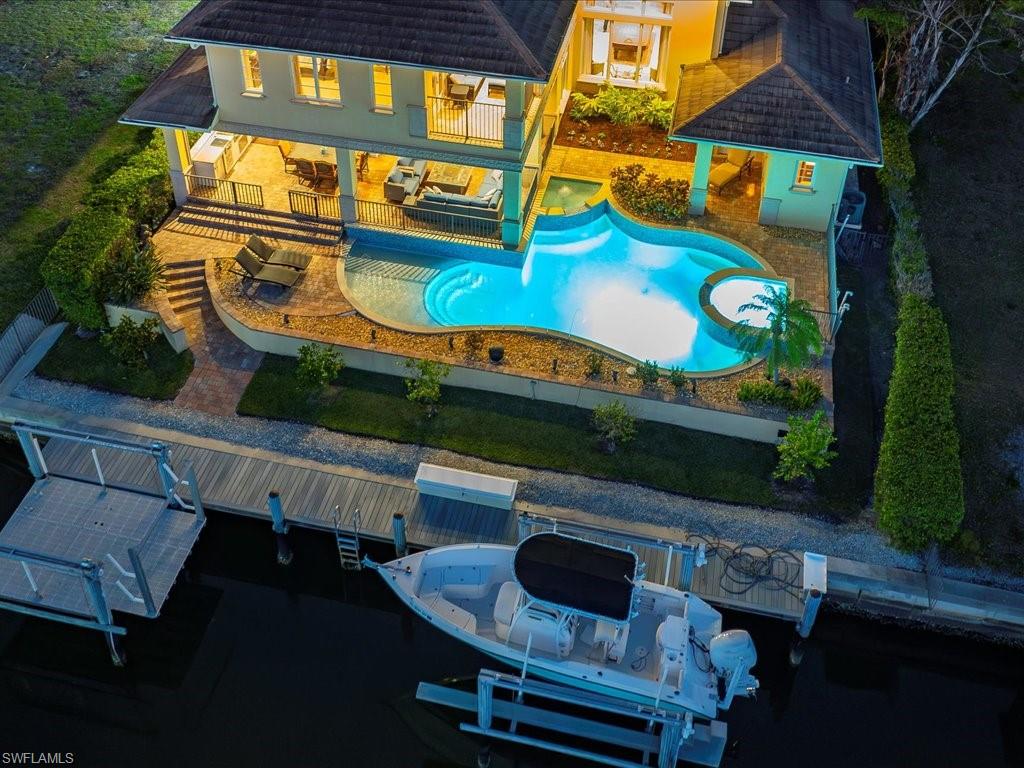 1550 Mullet Lane Naples, FL 34102 - Photo 4 of 50 swimming pool view with seating space