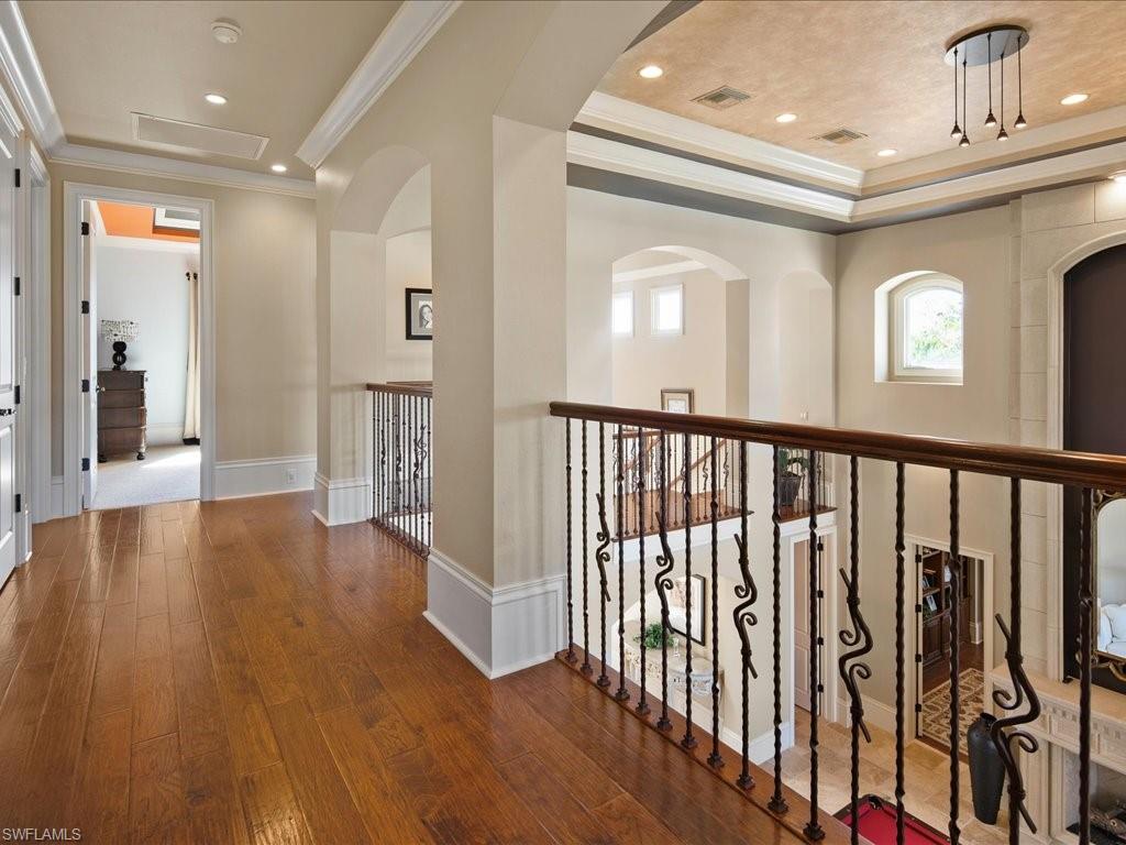1550 Mullet Lane Naples, FL 34102 - Photo 41 of 50 a view of a hallway with wooden floor
