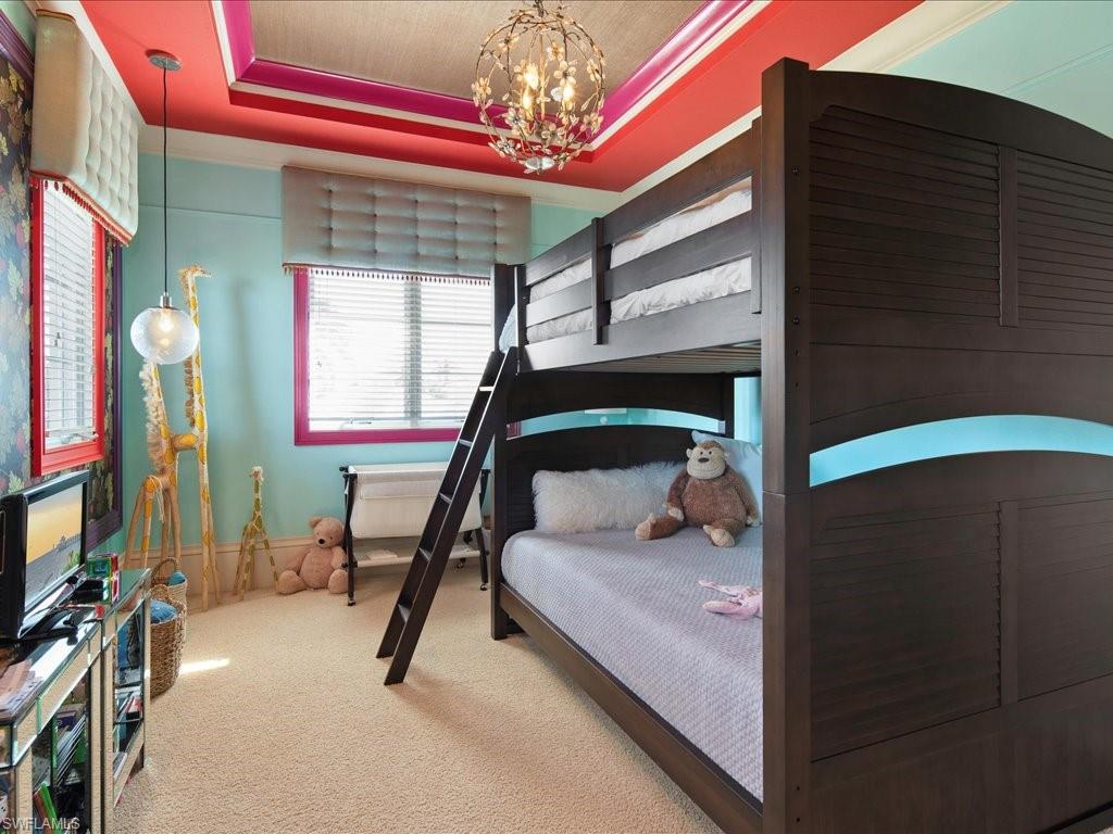 1550 Mullet Lane Naples, FL 34102 - Photo 42 of 50 a bedroom with balcony and a bed