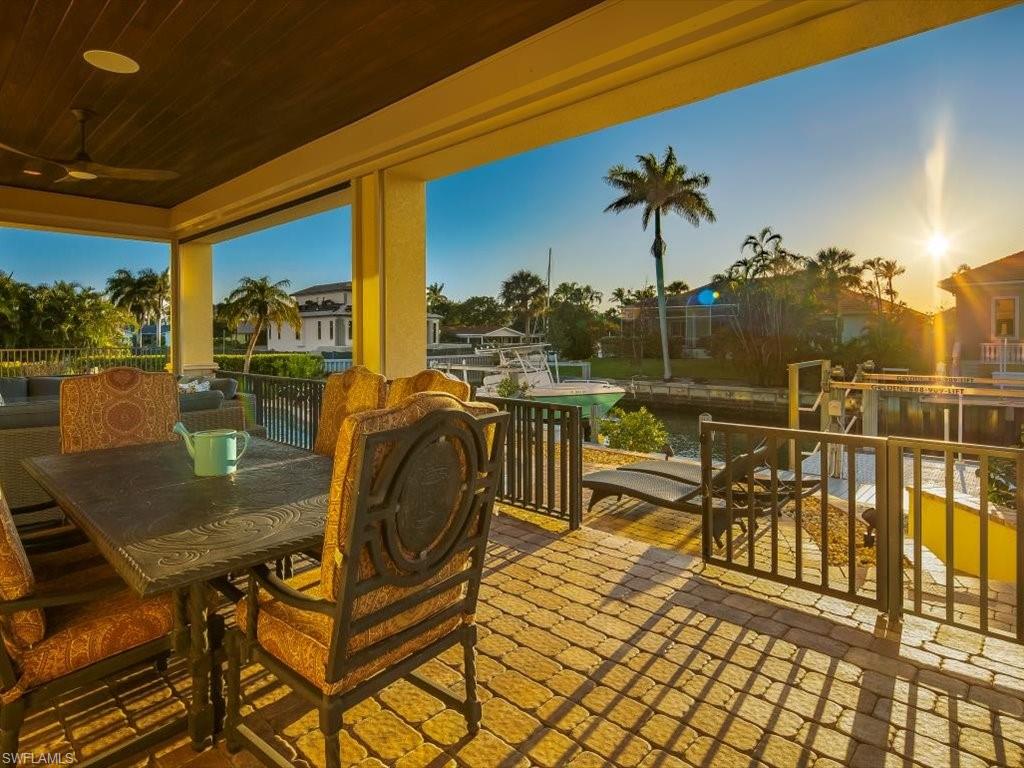 1550 Mullet Lane Naples, FL 34102 - Photo 5 of 50 a view of a balcony with chairs