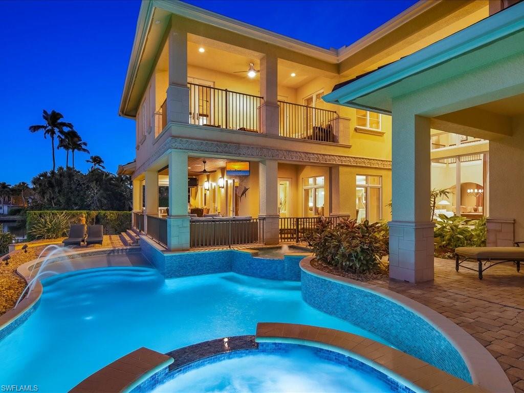 1550 Mullet Lane Naples, FL 34102 - Photo 8 of 50 a view of a house with swimming pool patio and swimming pool