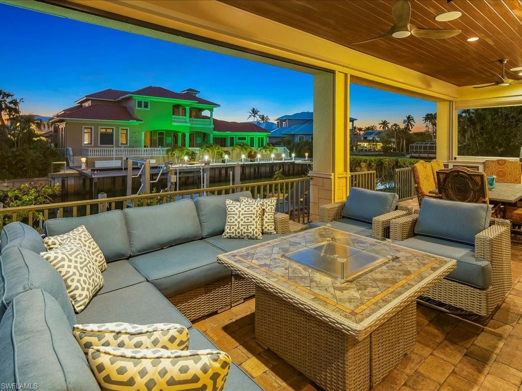 1550 Mullet Lane Naples, FL 34102 - Photo 10 of 50 a view of a patio with swimming pool