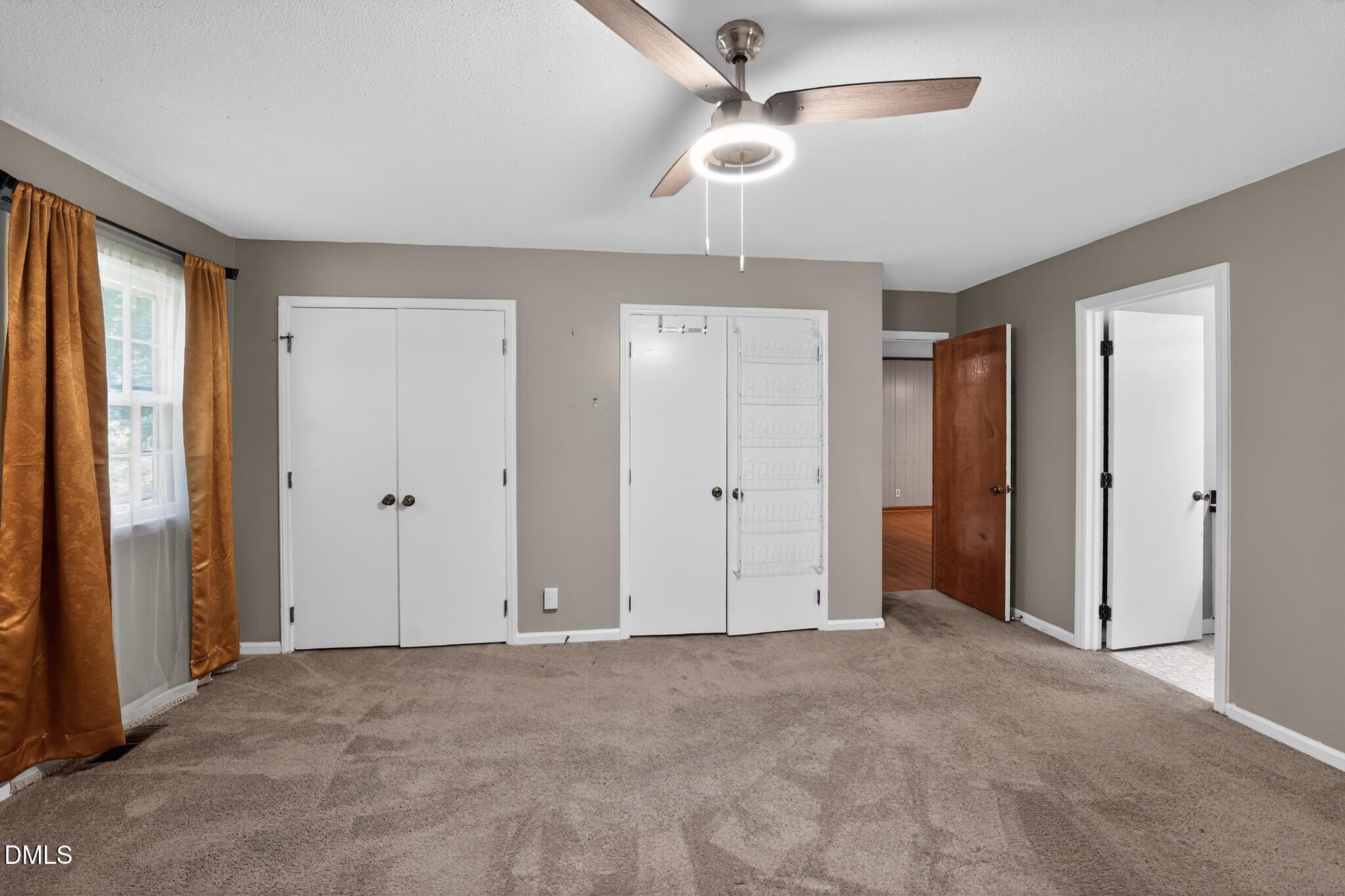 1034 Jerome Road Durham, NC 27713 - Photo 27 of 35 a view of an empty room with a ceiling fan