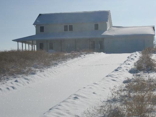 91141 Melugins Grove Road Compton, IL 61318 - Photo 1 of 1 a view of a house with a snow on the road