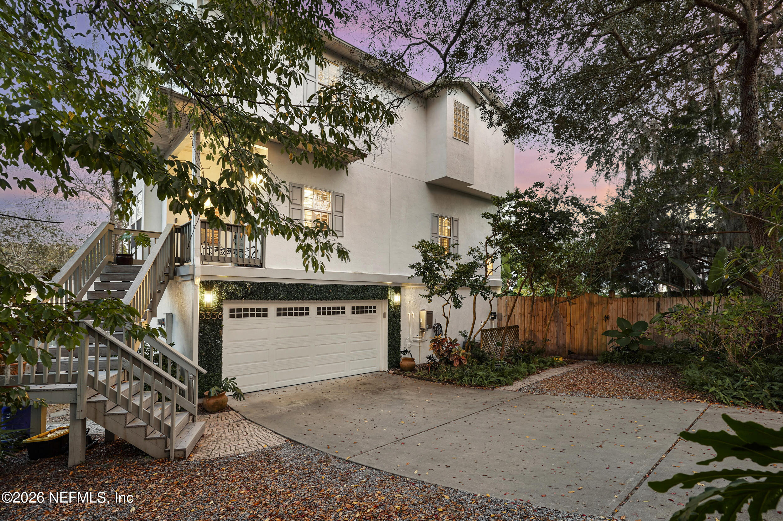 3336 Carmel Road St. Augustine, FL 32086 - Photo 1 of 55 a front view of a house with a yard and garage