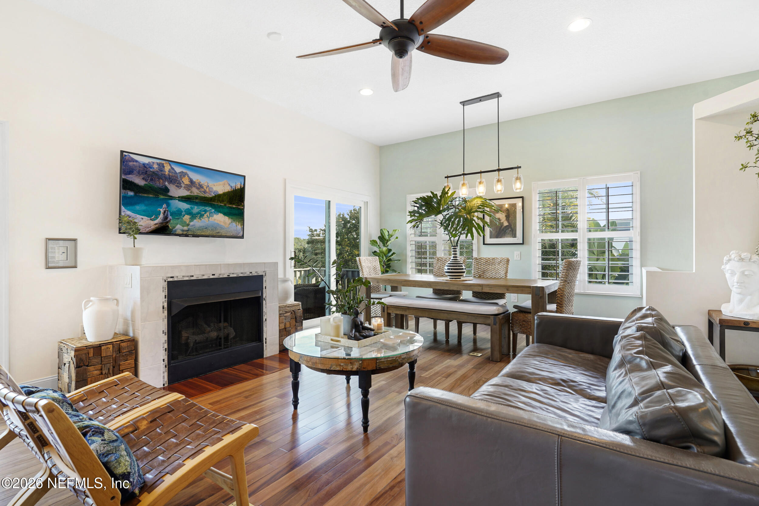 3336 Carmel Road St. Augustine, FL 32086 - Photo 15 of 55 a living room with furniture fireplace and flat screen tv