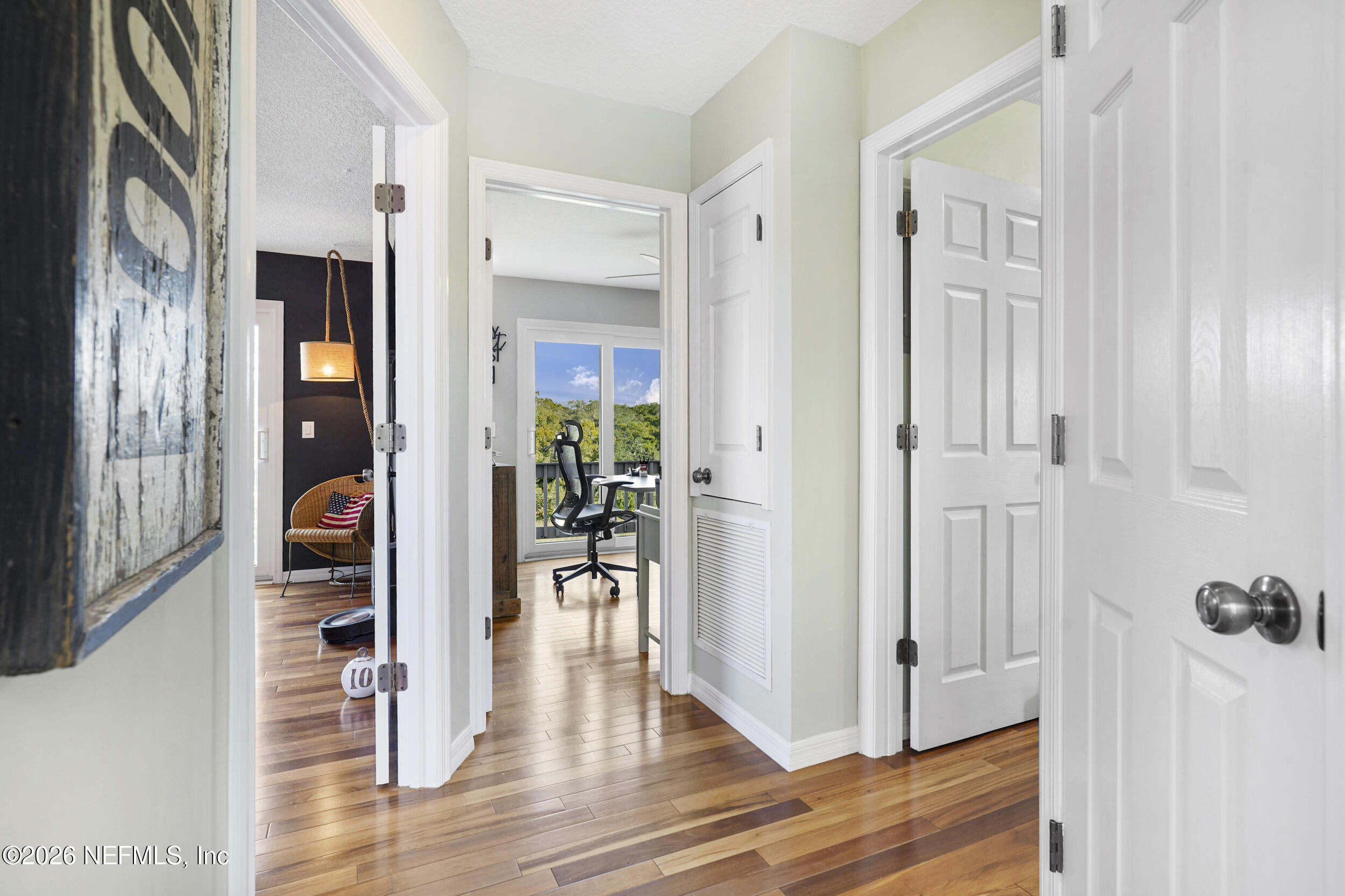 3336 Carmel Road St. Augustine, FL 32086 - Photo 21 of 55 a view of a hallway with wooden floor and dining room