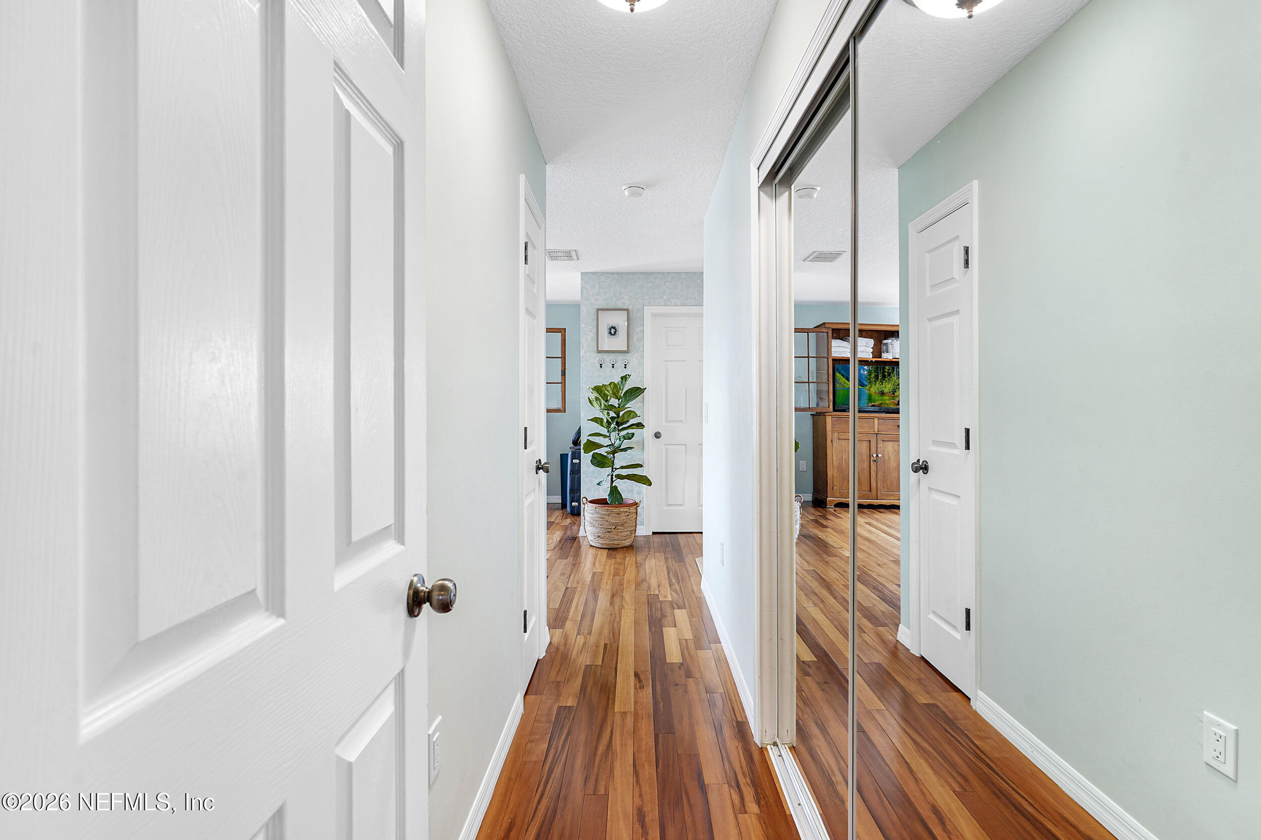 3336 Carmel Road St. Augustine, FL 32086 - Photo 27 of 55 a view of a hallway with wooden floor and staircase