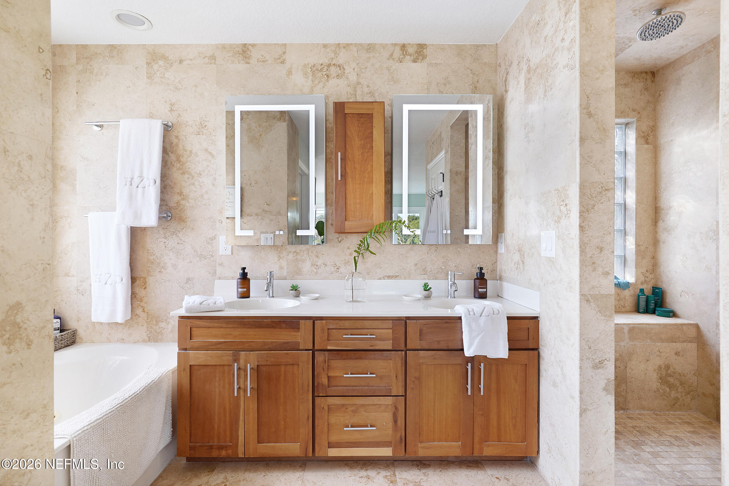 3336 Carmel Road St. Augustine, FL 32086 - Photo 31 of 55 a bathroom with a double vanity sink mirror and bathtub