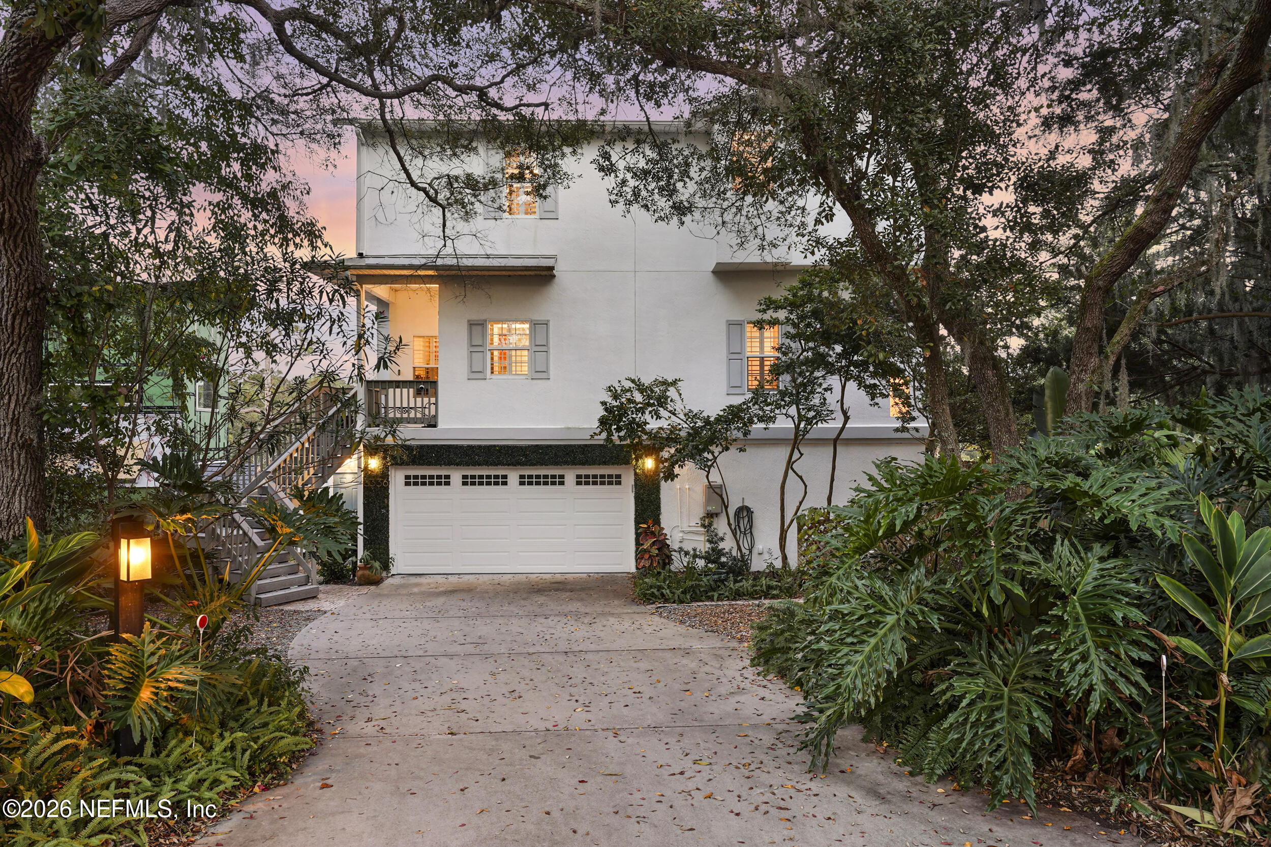 3336 Carmel Road St. Augustine, FL 32086 - Photo 5 of 55 a front view of a house with a yard and garage