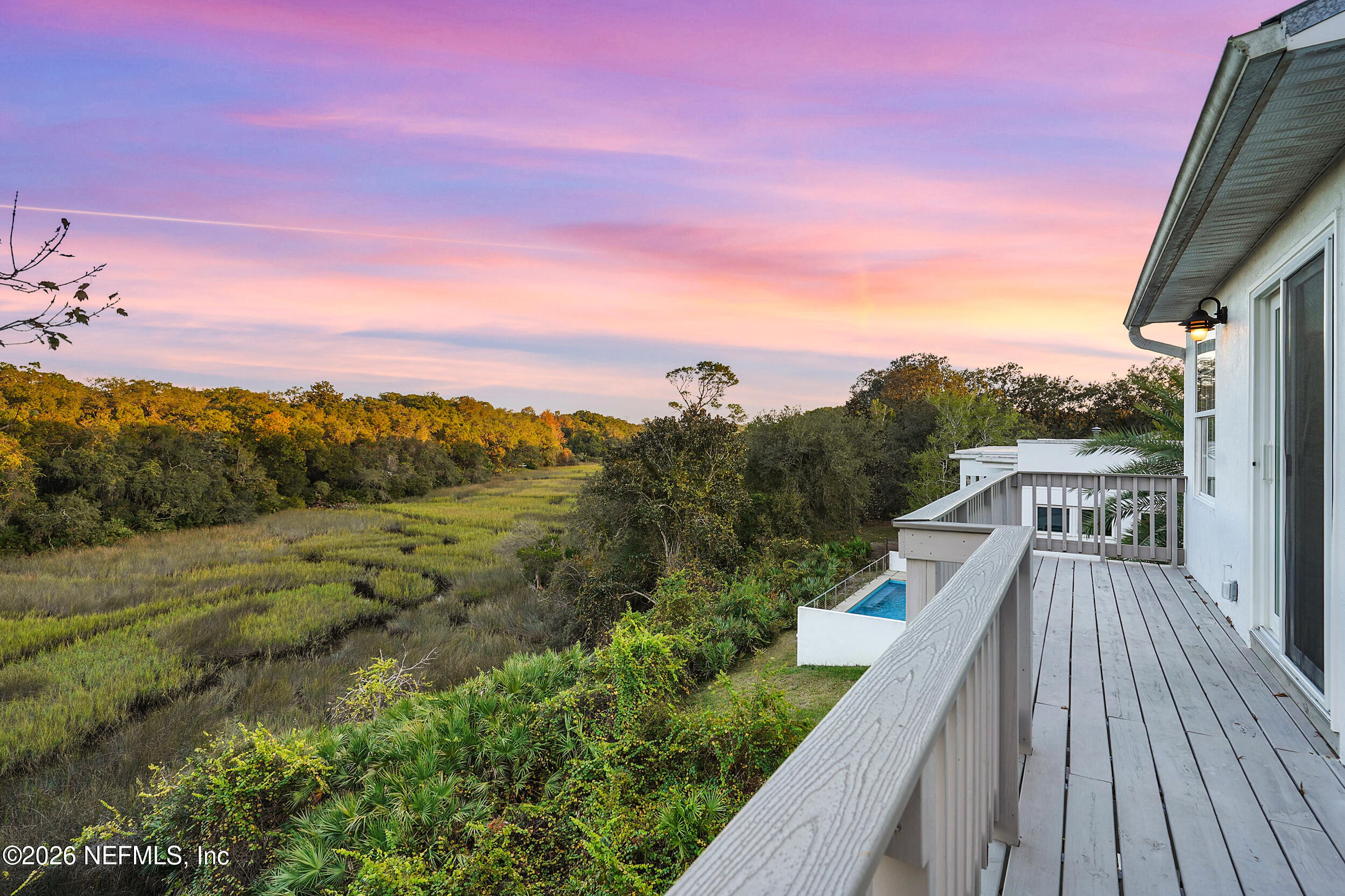 3336 Carmel Road St. Augustine, FL 32086 - Photo 54 of 55 a view of a balcony with wooden floor and fence