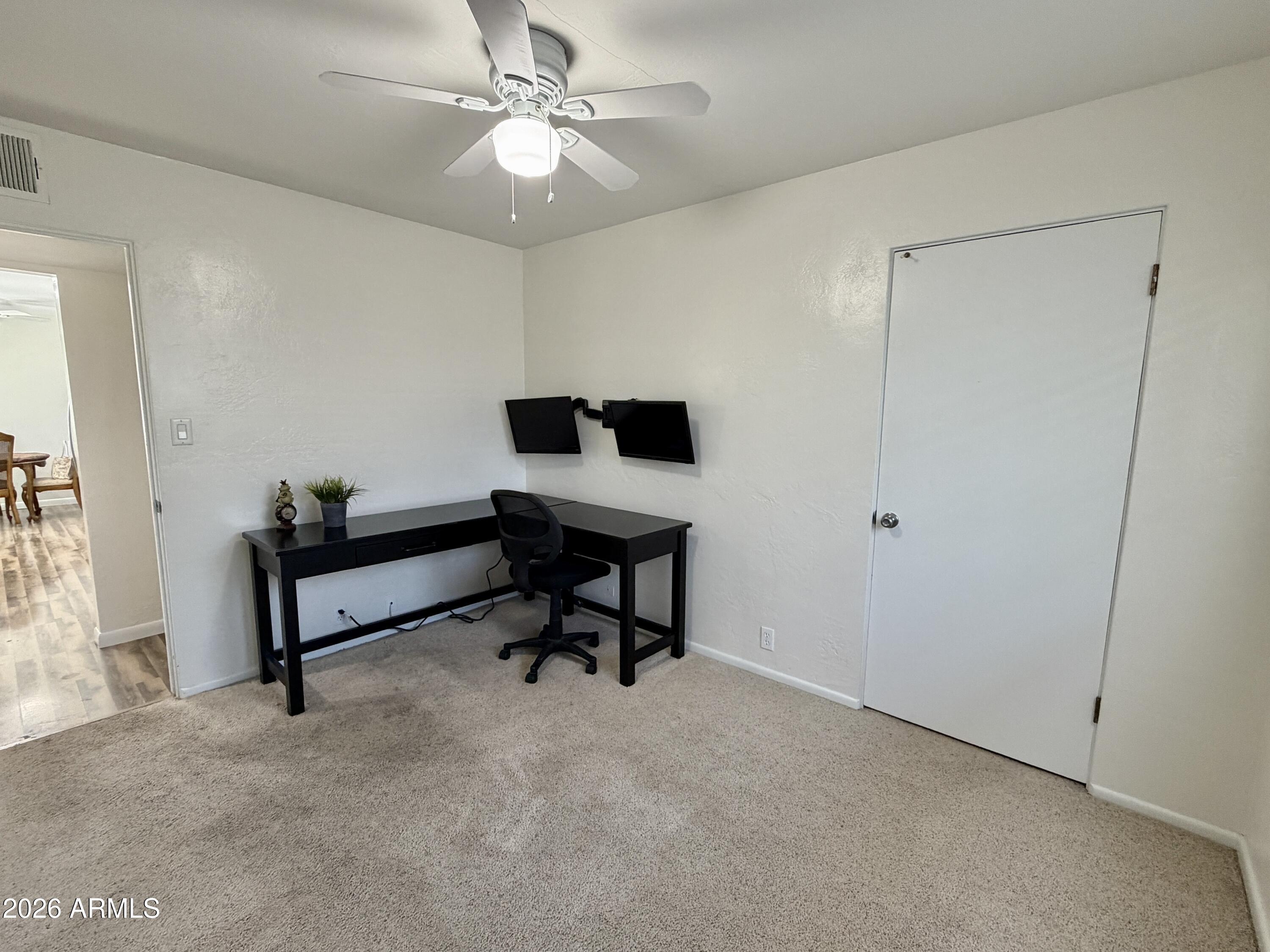 543 West 18th Street Tempe, AZ 85281 - Photo 20 of 29 a living room with furniture and a ceiling fan