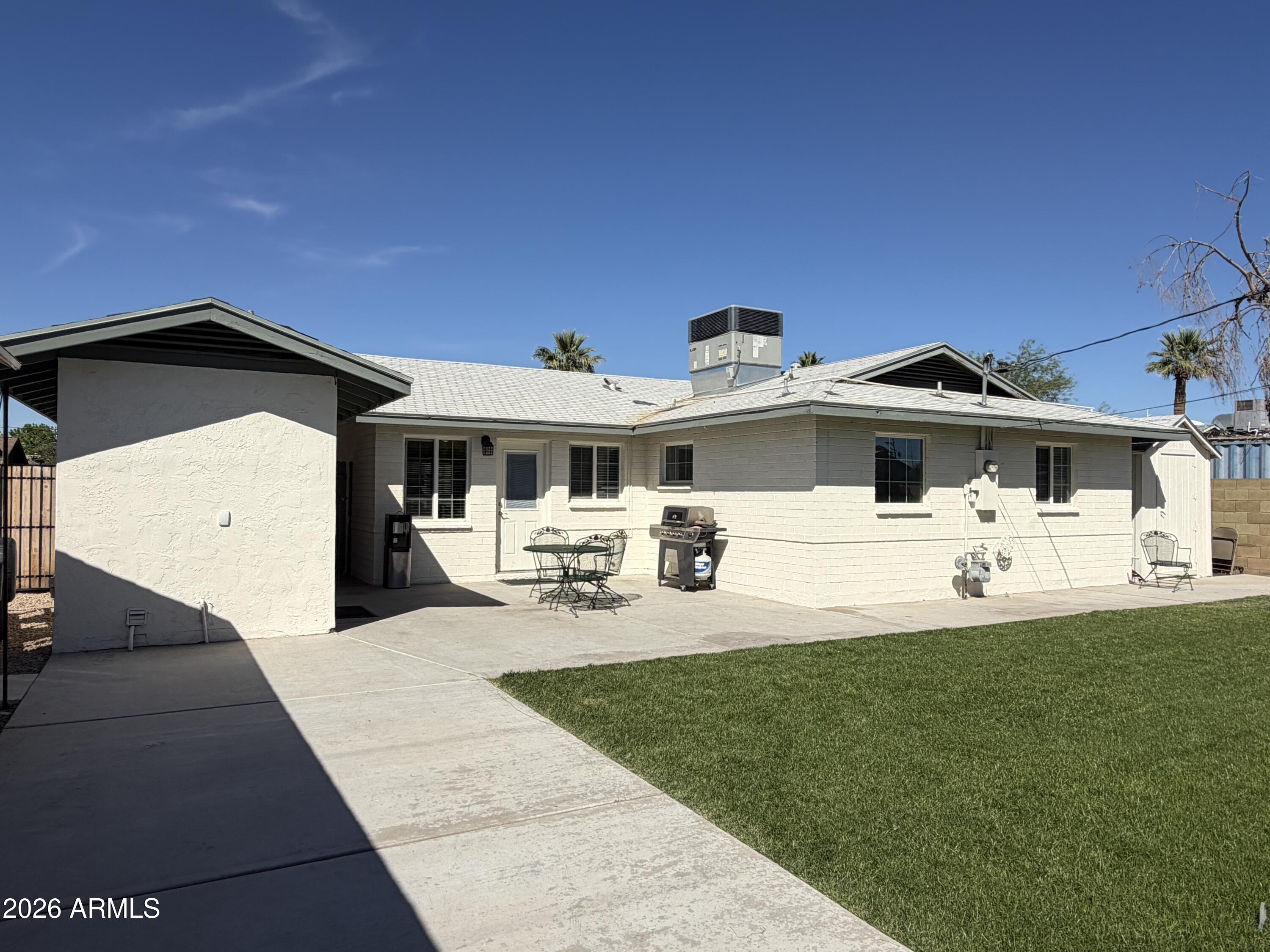 543 West 18th Street Tempe, AZ 85281 - Photo 22 of 29 a front view of a house with swimming pool and porch with furniture
