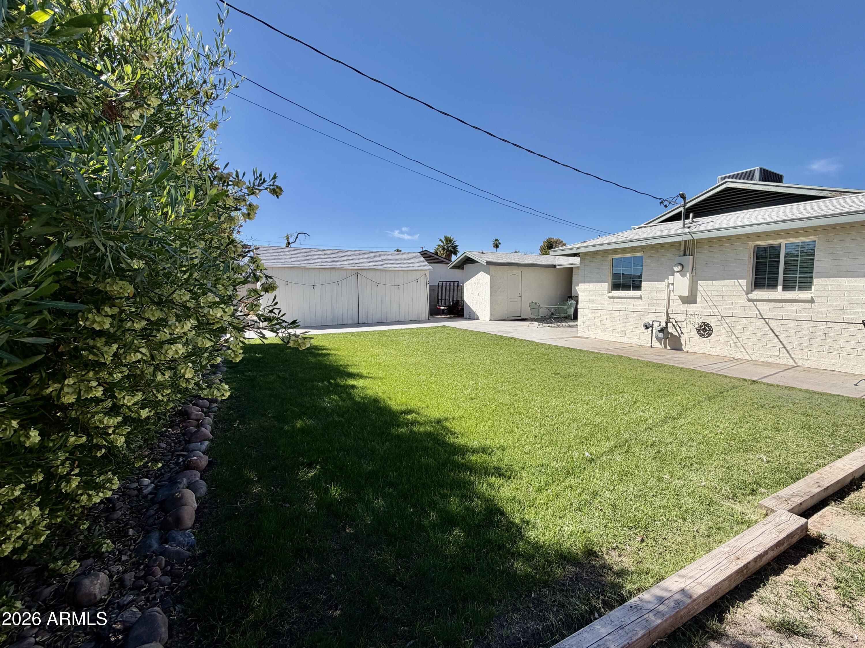 543 West 18th Street Tempe, AZ 85281 - Photo 24 of 29 a view of a house with backyard and sitting area