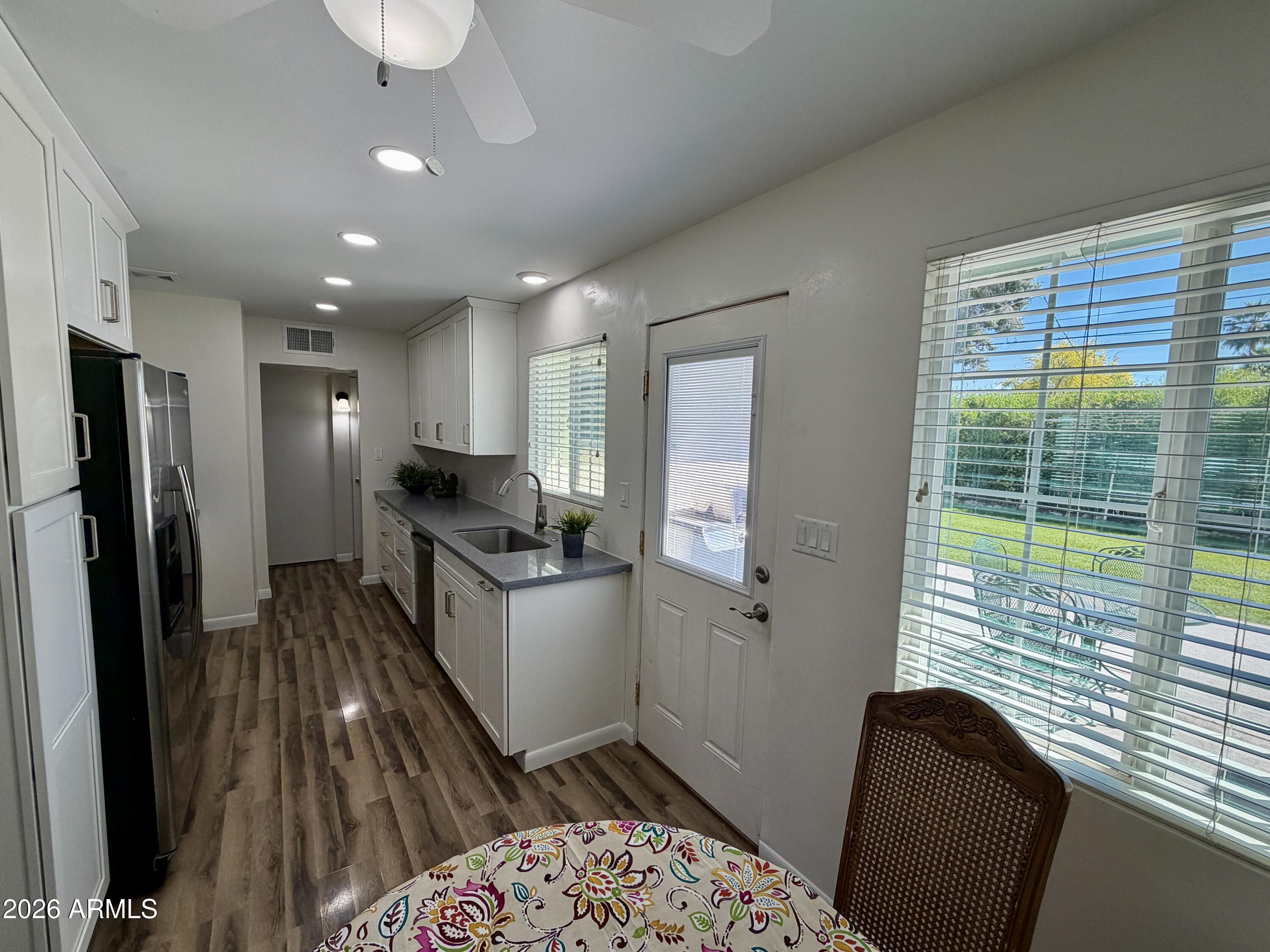 543 West 18th Street Tempe, AZ 85281 - Photo 5 of 29 a kitchen with a refrigerator and a sink