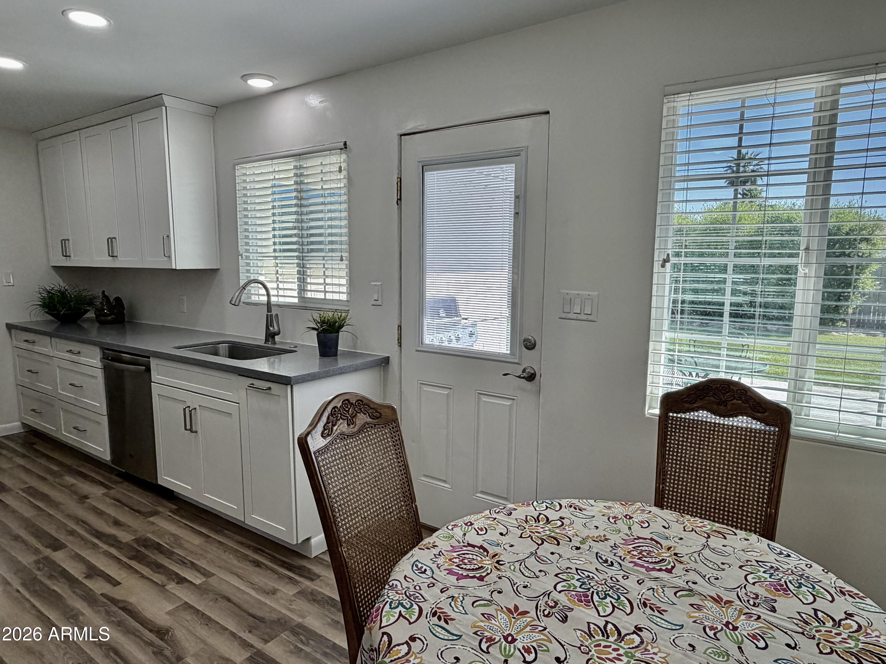 543 West 18th Street Tempe, AZ 85281 - Photo 8 of 29 a kitchen with a window dining table and chair