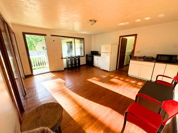 a view of a living room with furniture and a rug