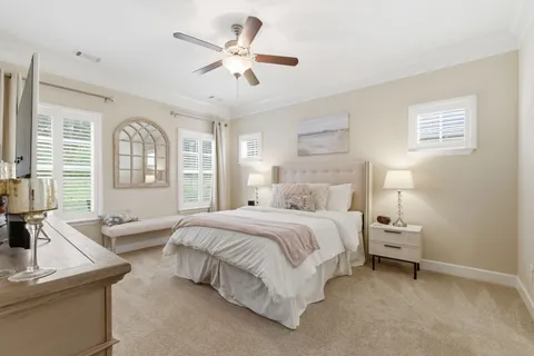 a bedroom with a large bed and a window