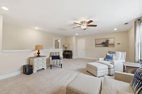 a bedroom with furniture and a chandelier