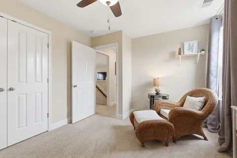 a living room with furniture and a window