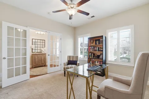 a workspace with furniture and a window