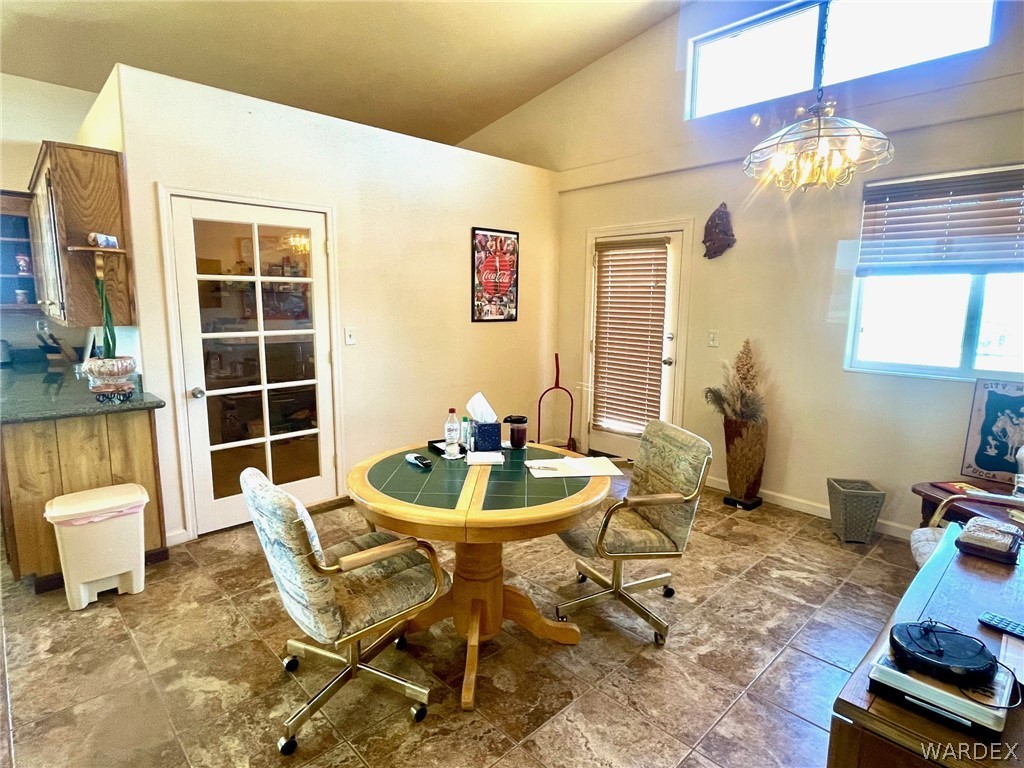 21477 South Sundance Kid Road Yucca, AZ 86438 - Photo 18 of 66 a dining room with furniture and wooden floor