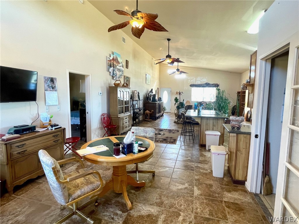 21477 South Sundance Kid Road Yucca, AZ 86438 - Photo 19 of 66 a view of a dining room with furniture
