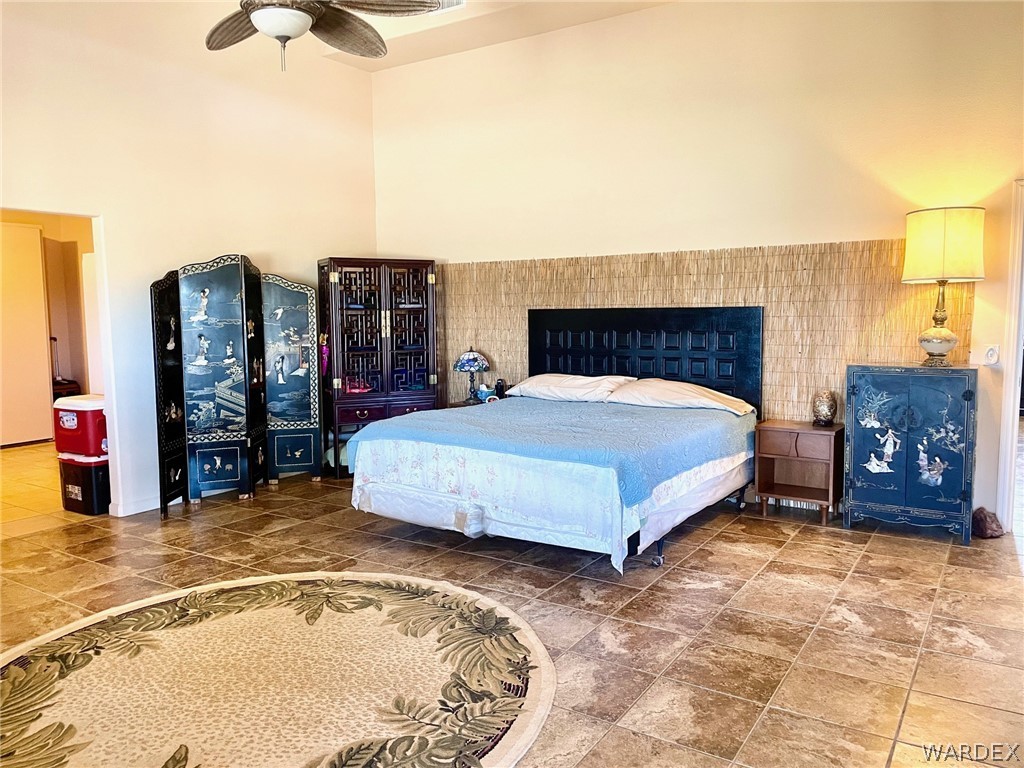 21477 South Sundance Kid Road Yucca, AZ 86438 - Photo 22 of 66 a bedroom with a bed and dresser