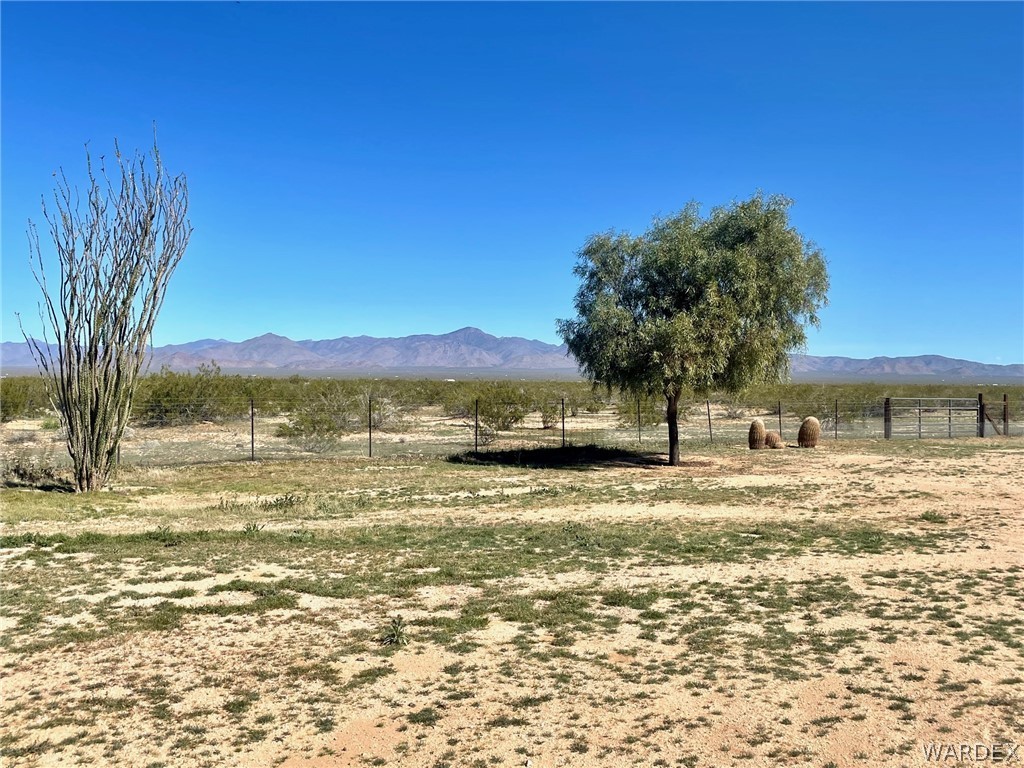 21477 South Sundance Kid Road Yucca, AZ 86438 - Photo 52 of 66 a view of a large body of water with a building in the background
