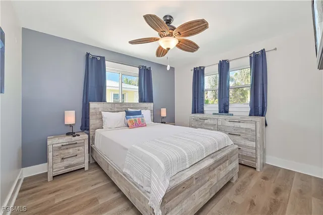 a bedroom with a large bed and a large window