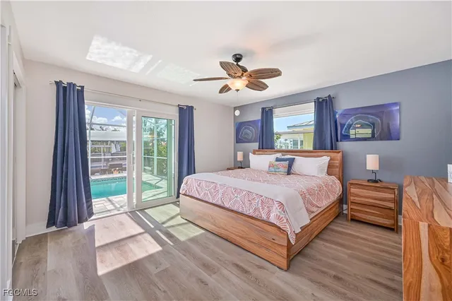 a spacious bedroom with a bed and a large window