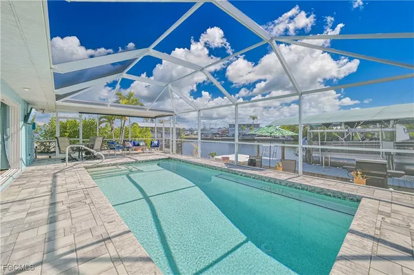 a view of a swimming pool with a patio