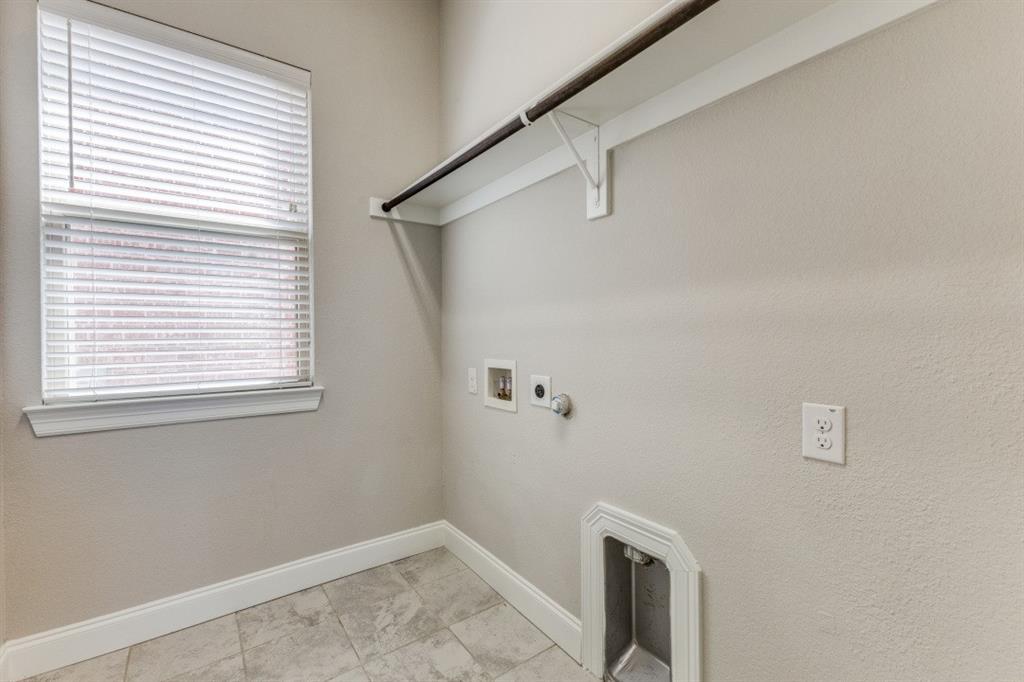 1064 Margo Drive Allen, TX 75013 - Photo 13 of 25 a view of storage and utility room with a window