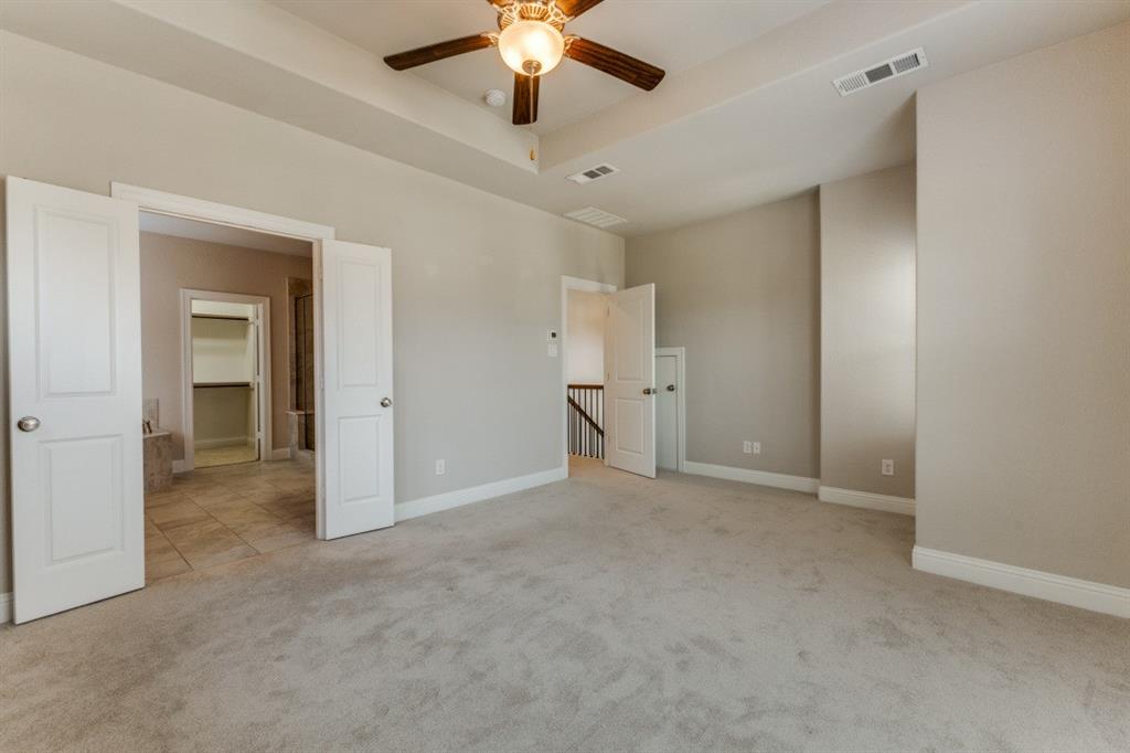 1064 Margo Drive Allen, TX 75013 - Photo 16 of 25 a view of an empty room and a ceiling fan