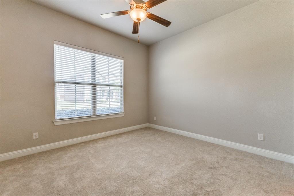 1064 Margo Drive Allen, TX 75013 - Photo 22 of 25 an empty room with a window and a fan