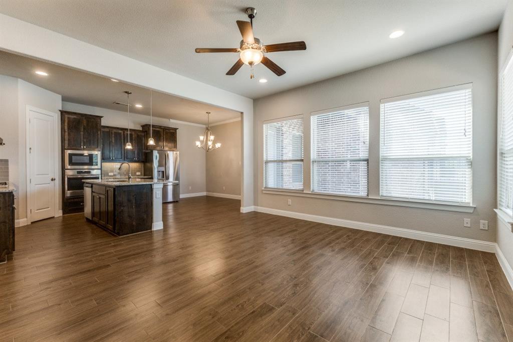 1064 Margo Drive Allen, TX 75013 - Photo 9 of 25 a view of an empty room with kitchen and a window