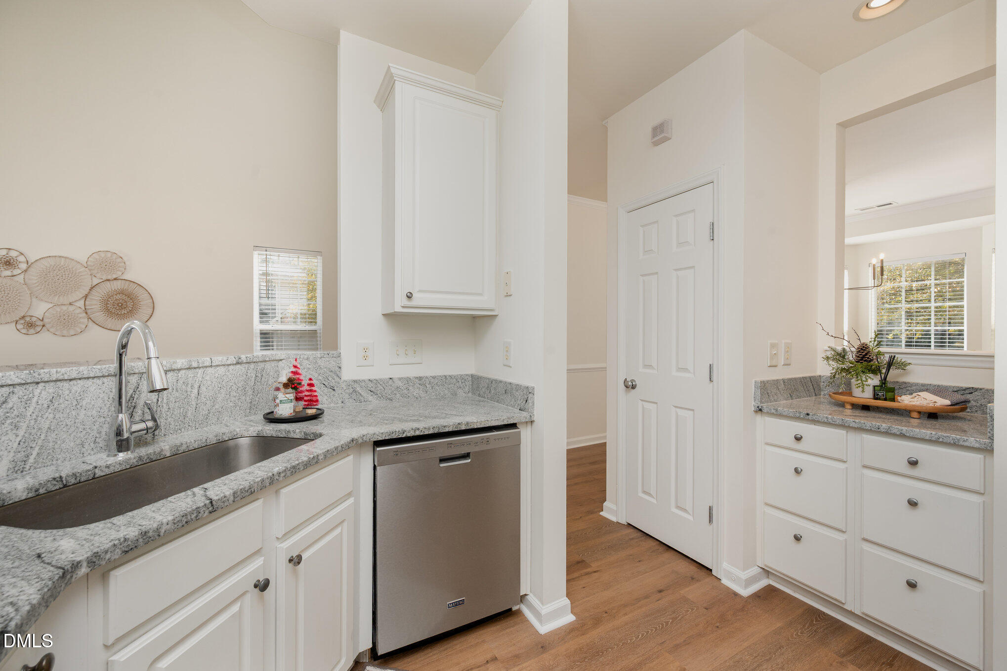 8400 Whisper Ridge Place Raleigh, NC 27613 - Photo 12 of 27 a kitchen with granite countertop white cabinets and a sink