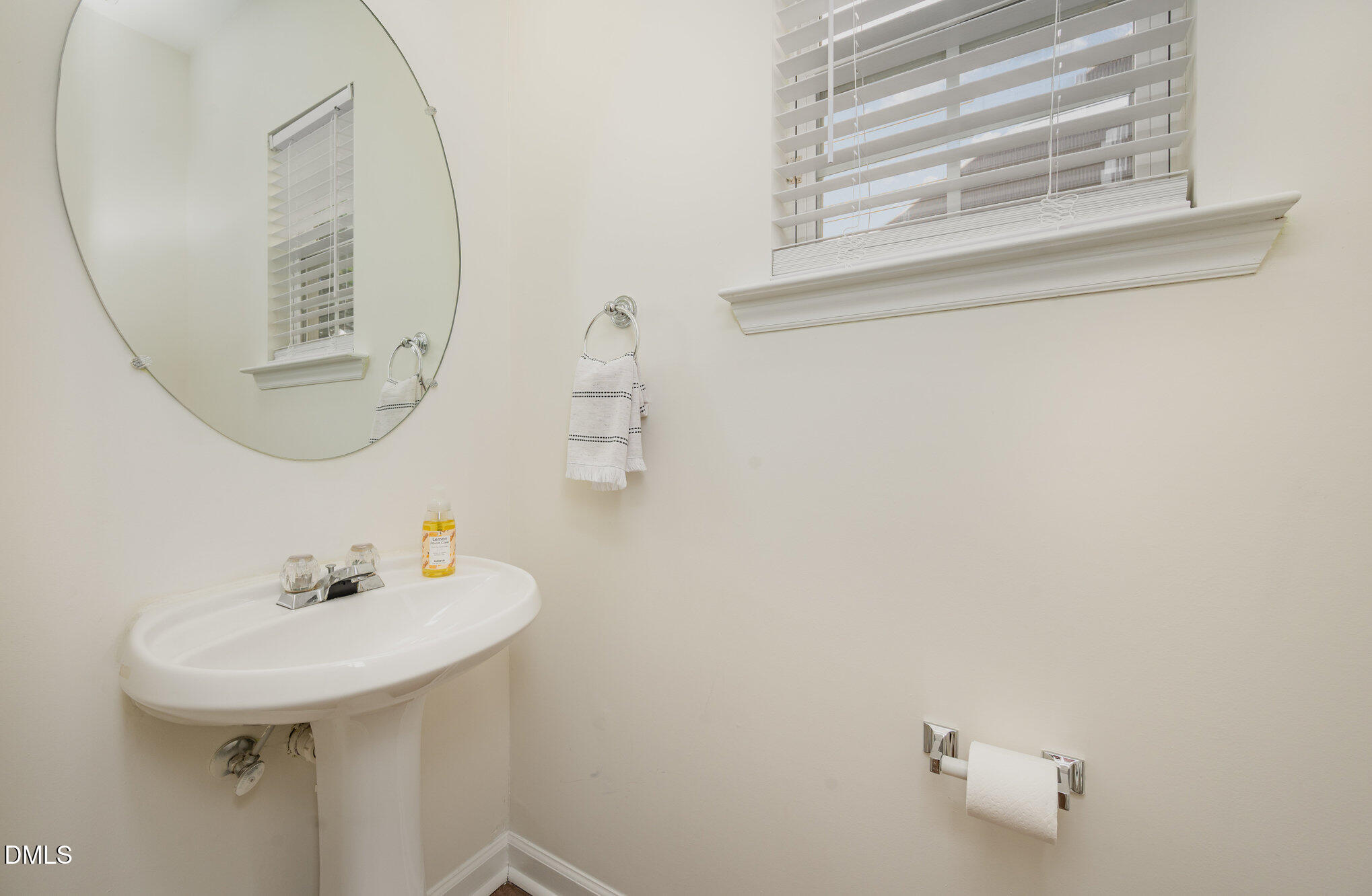 8400 Whisper Ridge Place Raleigh, NC 27613 - Photo 13 of 27 a bathroom with a sink and a mirror