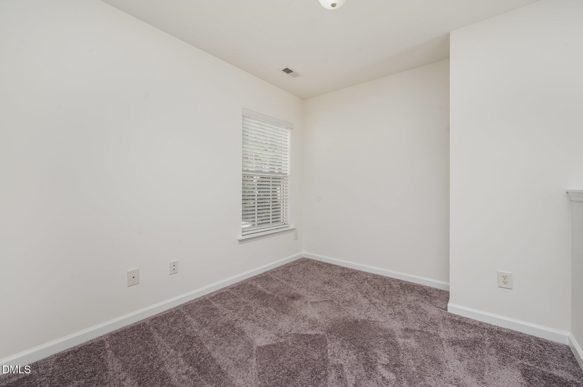 8400 Whisper Ridge Place Raleigh, NC 27613 - Photo 23 of 27 an empty room with a window