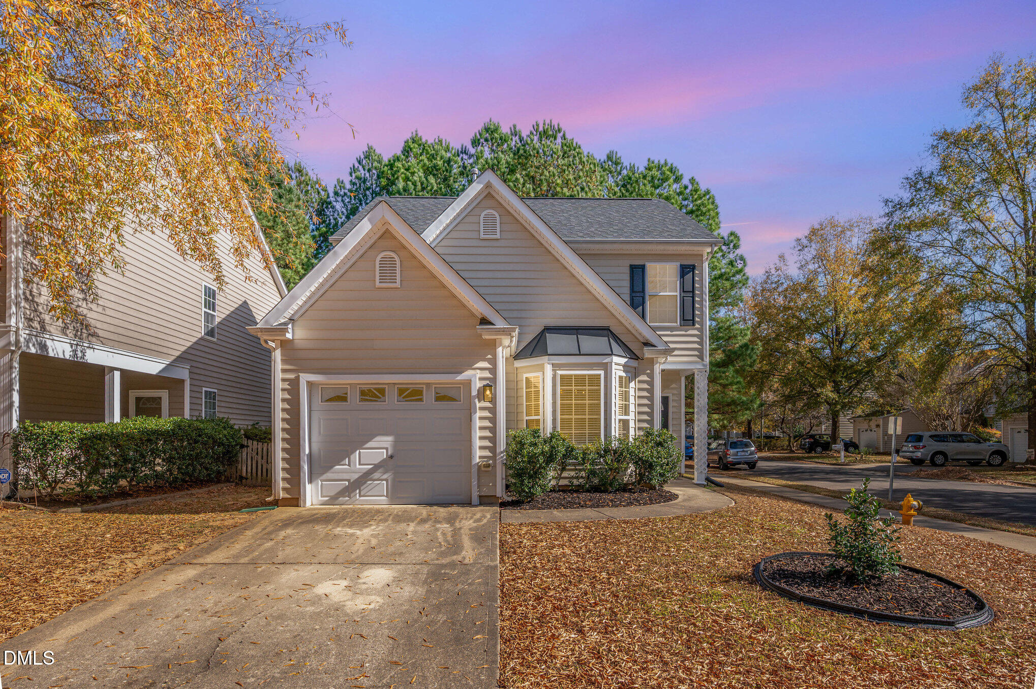 8400 Whisper Ridge Place Raleigh, NC 27613 - Photo 3 of 27 a front view of a house with garden