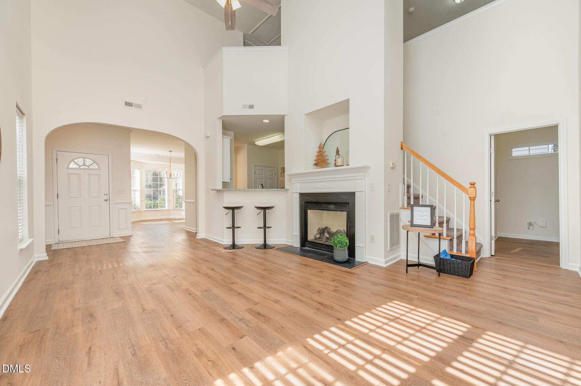 8400 Whisper Ridge Place Raleigh, NC 27613 - Photo 8 of 27 a view of a livingroom with wooden floor and a fireplace