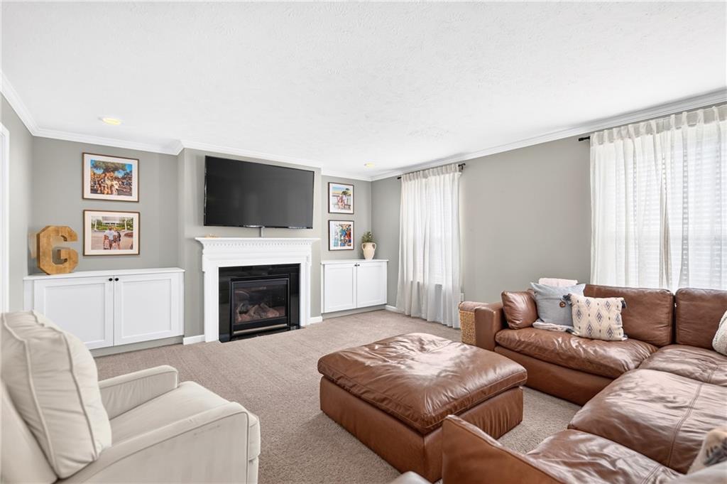 259 Foxwood Road Coraopolis, PA 15108 - Photo 19 of 49 Family Room - Experience the heart of the home in this spacious family room, featuring built-in cabinets that offer ample storage and display space.