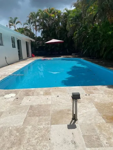 a view of a backyard of the house