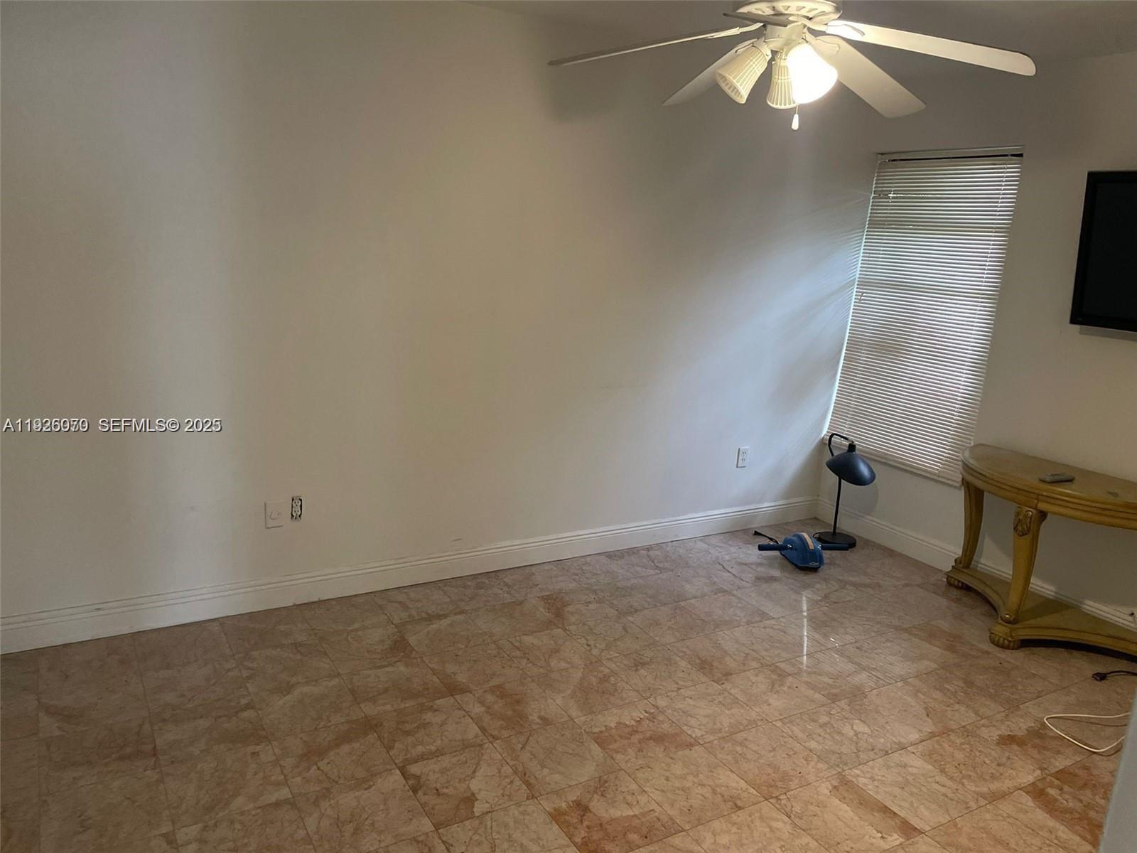 13424 Southwest 90th Terrace Miami, FL 33186 - Photo 13 of 14 an empty room with a workbench