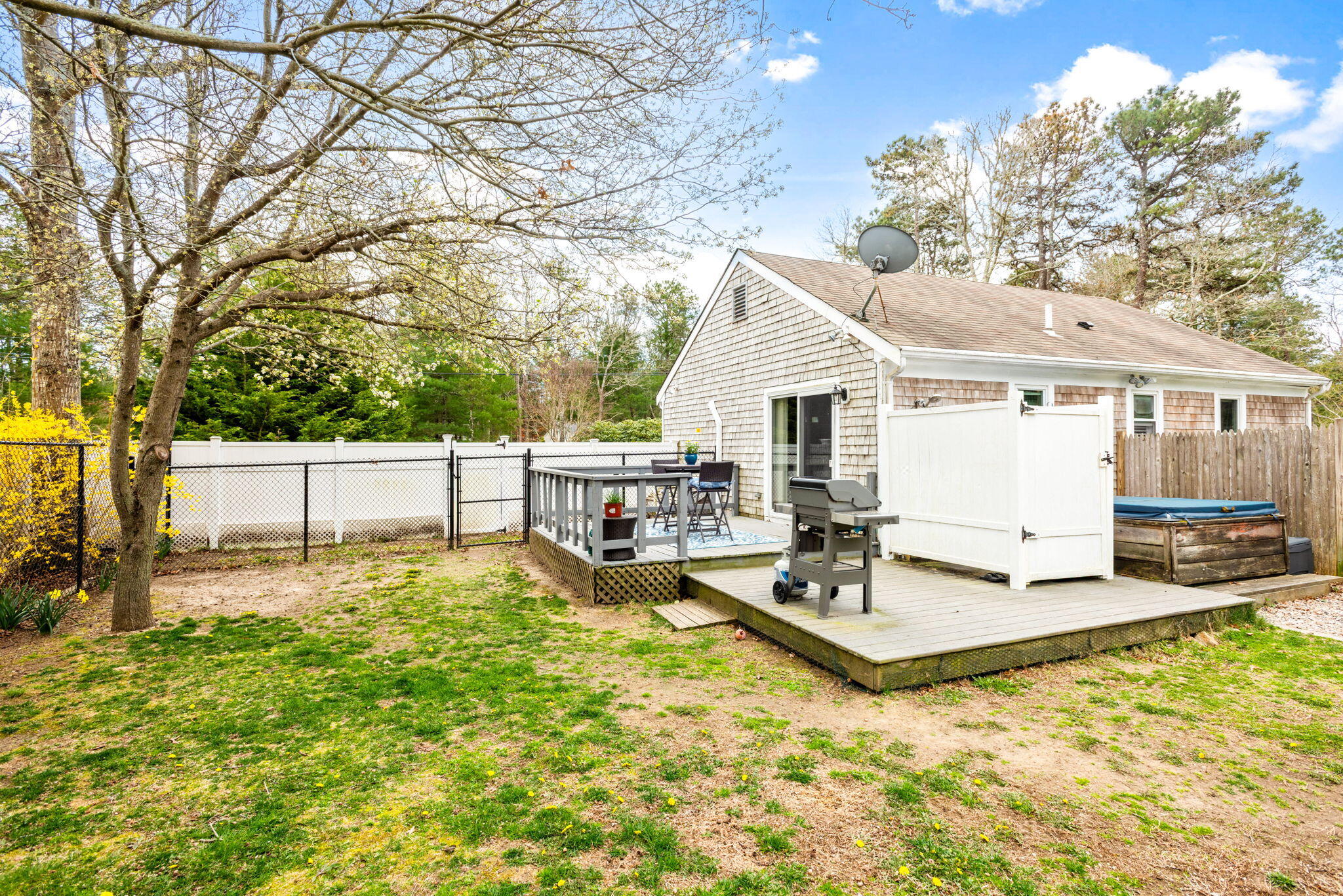 67 Degrass Road Mashpee, MA 02649 - Photo 20 of 24 a view of a house with backyard and sitting area