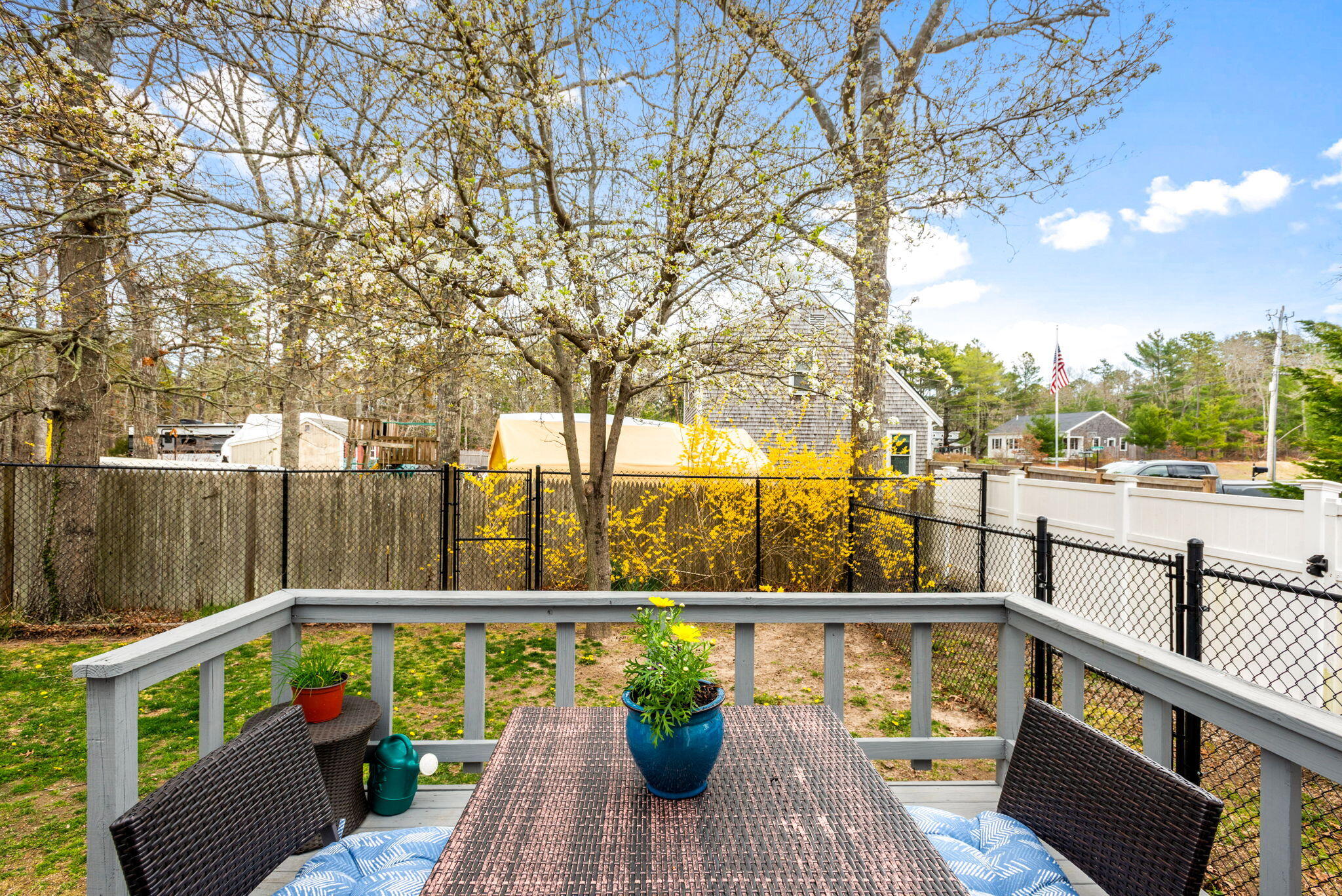 67 Degrass Road Mashpee, MA 02649 - Photo 24 of 24 a view of a balcony with wooden chairs