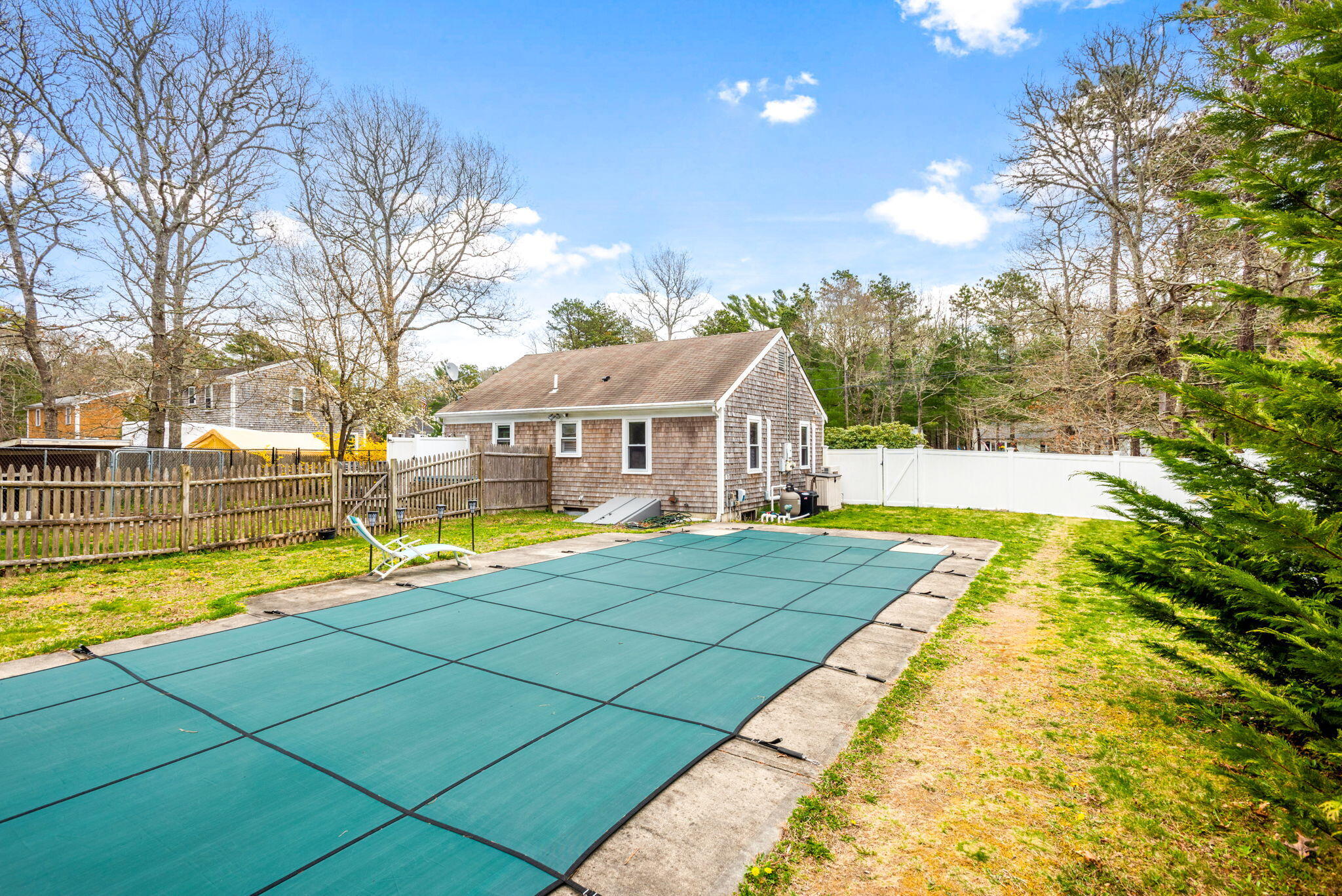 67 Degrass Road Mashpee, MA 02649 - Photo 4 of 24 a view of swimming pool with lounge area
