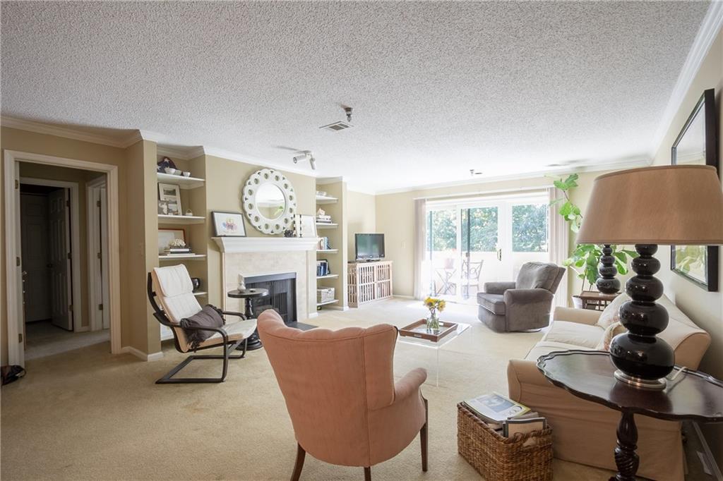 203 Ridley Howard Court, Unit 203 Decatur, GA 30030 - Photo 1 of 1 Open living room area with great balcony. Perfect spot to enjoy a glass of wine or your morning coffee!