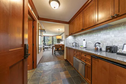 a kitchen with sink cabinets and outdoor living room