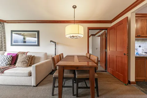 a view of a dining room with furniture and window